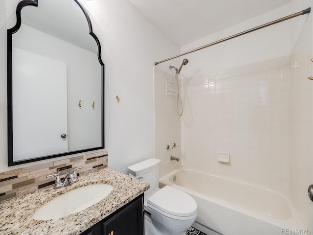 full bathroom with vanity, tiled shower / bath combo, decorative backsplash, and toilet