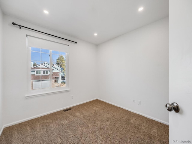 unfurnished room featuring carpet floors