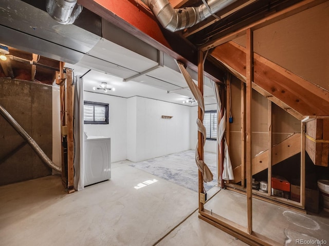 basement featuring a healthy amount of sunlight and washer / clothes dryer