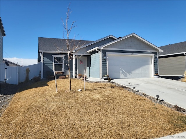 view of front of house featuring a garage and a front yard