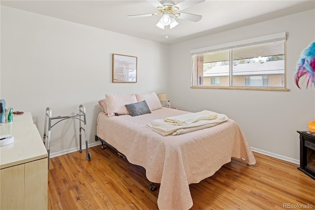 6004 S Prince St, Littleton, CO 80120 - bedroom with baseboards, light wood-type flooring, and a ceiling fan
