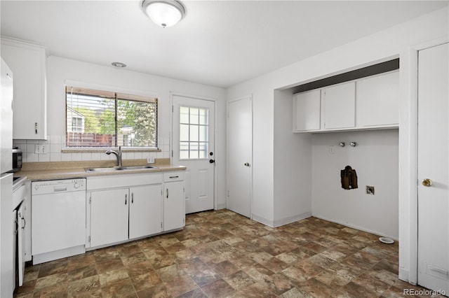 6004 S Prince St, Littleton, CO 80120 - washroom with stone finish floors, baseboards, and washer hookup