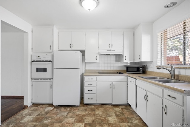 6004 S Prince St, Littleton, CO 80120 - kitchen featuring white appliances, a sink, under cabinet range hood, and white cabinets
