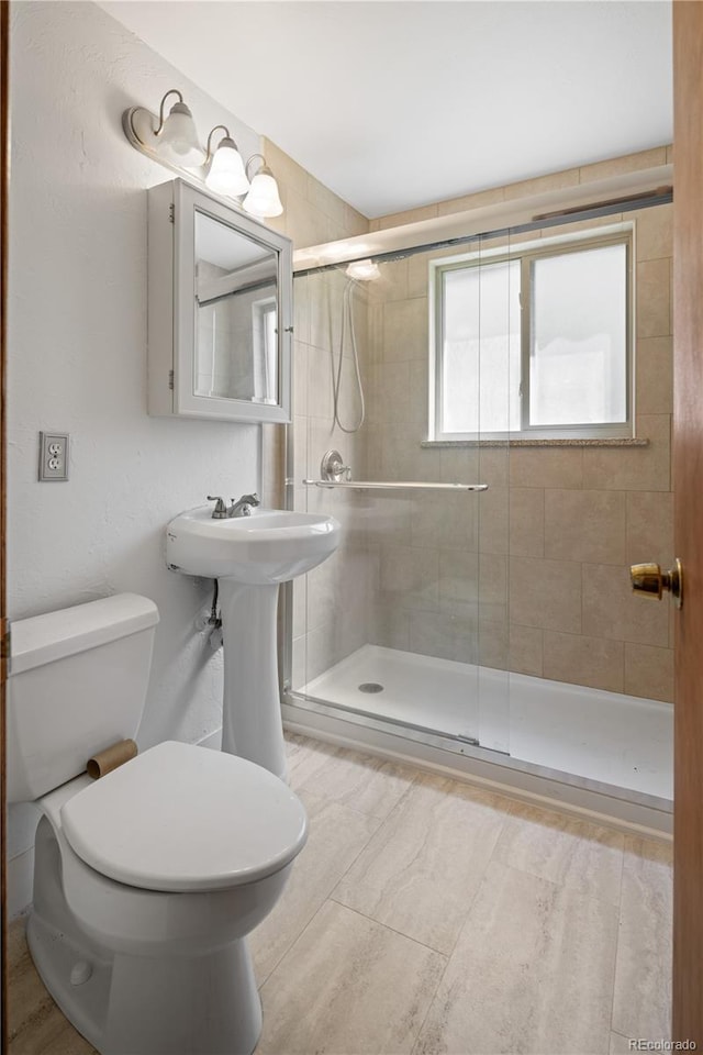 6004 S Prince St, Littleton, CO 80120 - full bath featuring toilet and a stall shower