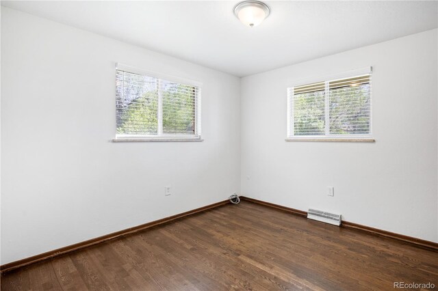 6004 S Prince St, Littleton, CO 80120 - empty room with healthy amount of natural light and baseboards