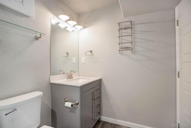 25525 E 1st Ave, Aurora, CO 80018 - bathroom with vanity and wood finished floors