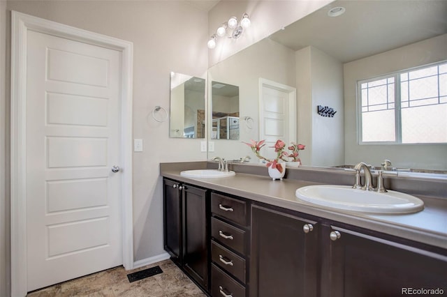 25525 E 1st Ave, Aurora, CO 80018 - bathroom featuring double vanity and baseboards