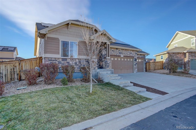 25525 E 1st Ave, Aurora, CO 80018 - view of front facade with stone siding, solar panels, driveway, and an attached garage