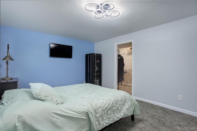 25525 E 1st Ave, Aurora, CO 80018 - bedroom with carpet flooring and a walk in closet