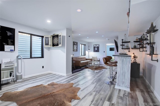 25525 E 1st Ave, Aurora, CO 80018 - living area with wood finished floors, healthy amount of natural light, and recessed lighting