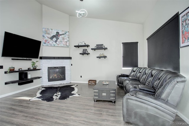 25525 E 1st Ave, Aurora, CO 80018 - living area featuring wood finished floors and a fireplace
