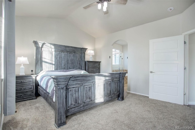 25525 E 1st Ave, Aurora, CO 80018 - bedroom with carpet, arched walkways, vaulted ceiling, a ceiling fan, and ensuite bathroom