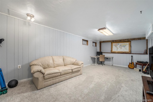 living room featuring carpet floors and baseboards