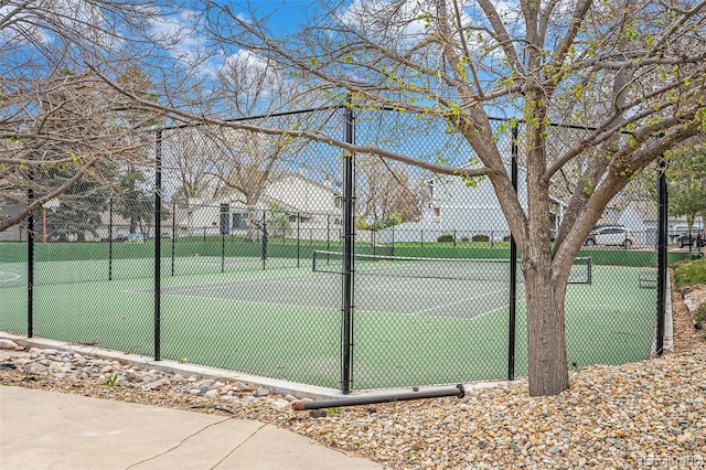 view of sport court featuring fence