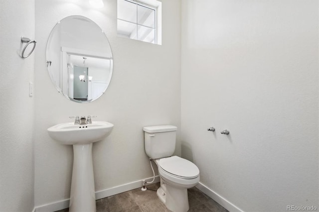 bathroom featuring tile patterned floors, sink, and toilet