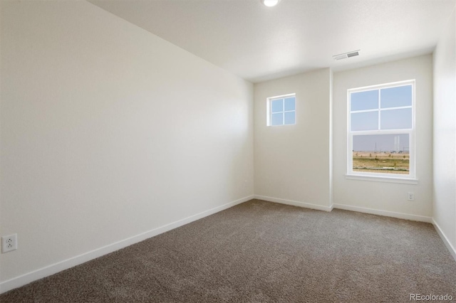 spare room with carpet floors