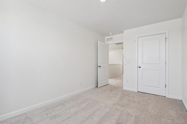 unfurnished bedroom with light colored carpet