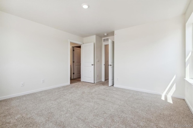 unfurnished bedroom with light carpet