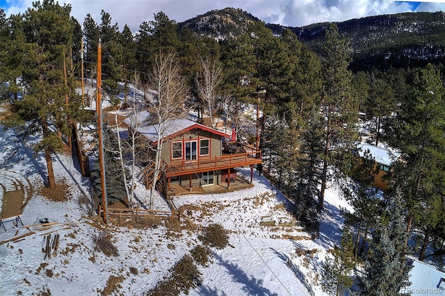 snowy aerial view featuring a mountain view