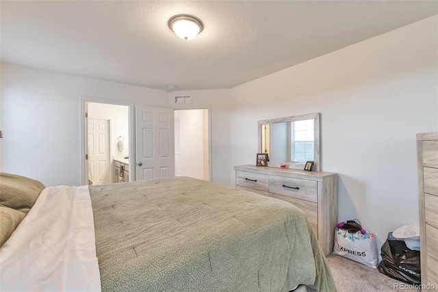 3963 N Quatar Ct, Aurora, CO 80019 - bedroom featuring light colored carpet and ensuite bath