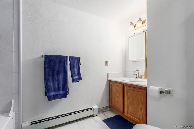 bathroom with a baseboard radiator and vanity