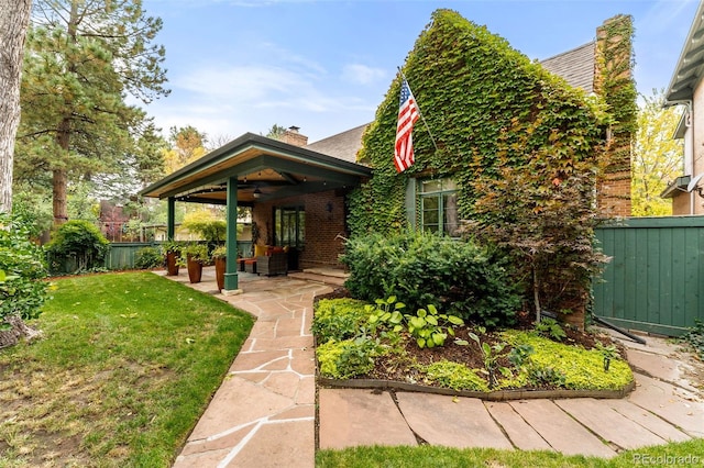 bungalow-style home with a patio area, a front yard, and ceiling fan