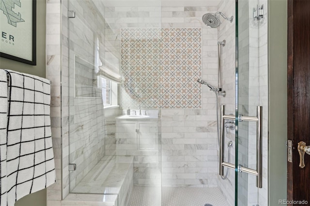 bathroom with a shower with shower door