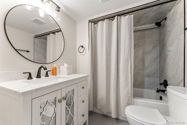 full bathroom featuring toilet, tile patterned flooring, shower / bath combo, and vanity