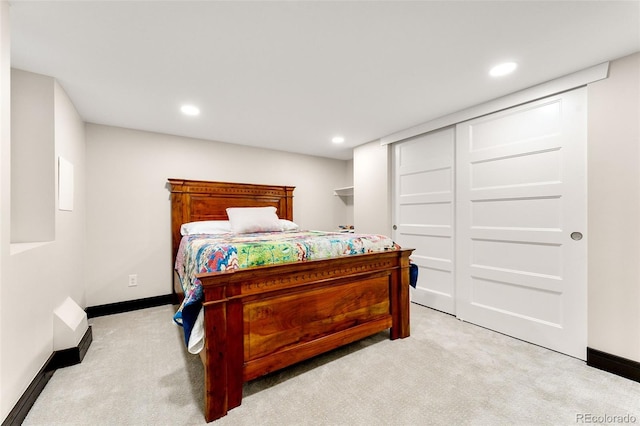 bedroom featuring light carpet