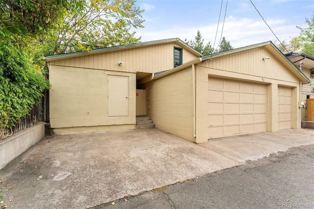 view of front facade featuring an outbuilding and a garage