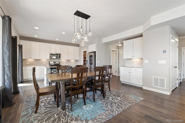 8235 Ryegate Way, Colorado Springs, CO 80908 - dining space with dark wood-style floors, baseboards, and recessed lighting