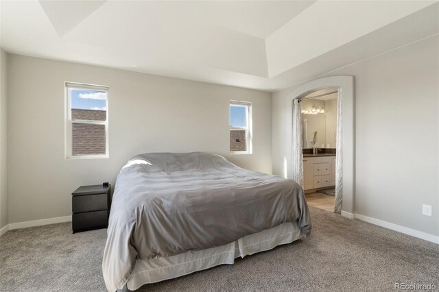 8235 Ryegate Way, Colorado Springs, CO 80908 - bedroom featuring baseboards, multiple windows, carpet floors, and ensuite bath