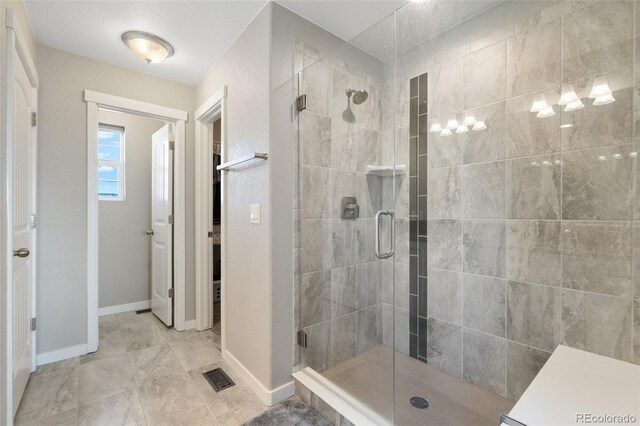 8235 Ryegate Way, Colorado Springs, CO 80908 - full bathroom with a shower stall and baseboards