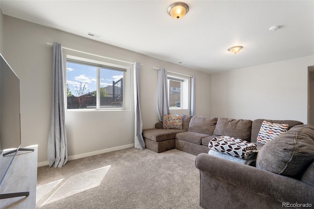 8235 Ryegate Way, Colorado Springs, CO 80908 - living area with plenty of natural light, carpet, and baseboards