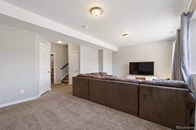 8235 Ryegate Way, Colorado Springs, CO 80908 - living area featuring carpet floors, baseboards, and stairs