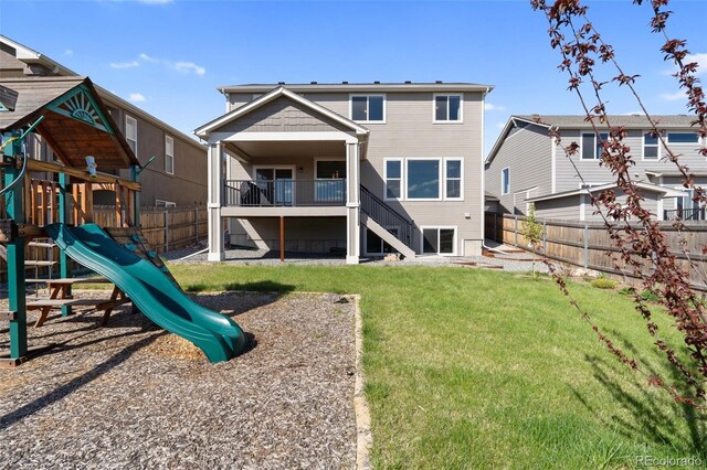 8235 Ryegate Way, Colorado Springs, CO 80908 - rear view of property featuring stairway and a playground