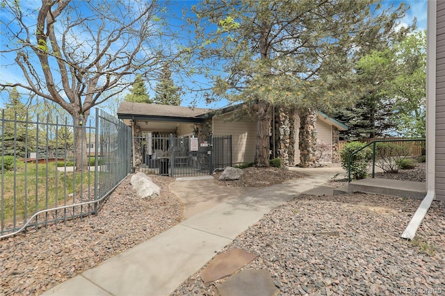 exterior space with a gate and a fenced front yard