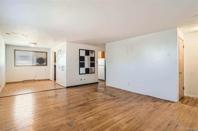 spare room featuring visible vents and light wood-style floors