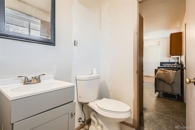 half bath featuring concrete flooring, vanity, and toilet