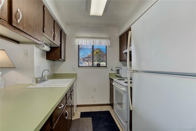 kitchen with sink, white appliances, and dark brown cabinets