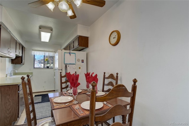 dining room with sink and ceiling fan