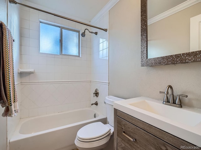 full bathroom with toilet, crown molding, vanity, and tiled shower / bath