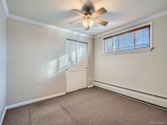 unfurnished room featuring ceiling fan, baseboard heating, carpet, and ornamental molding