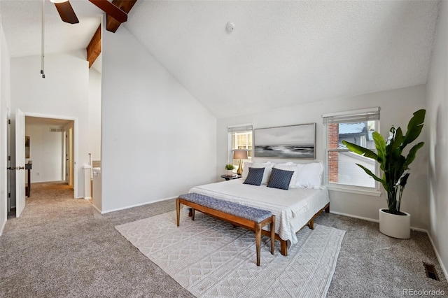 carpeted bedroom featuring ceiling fan, beamed ceiling, a textured ceiling, and high vaulted ceiling