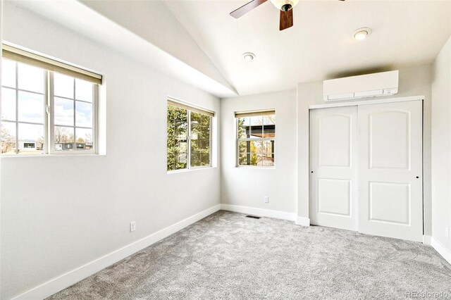 4530 Quitman St, Denver, CO 80212 - unfurnished bedroom with a wall mounted air conditioner, vaulted ceiling, a closet, carpet, and baseboards
