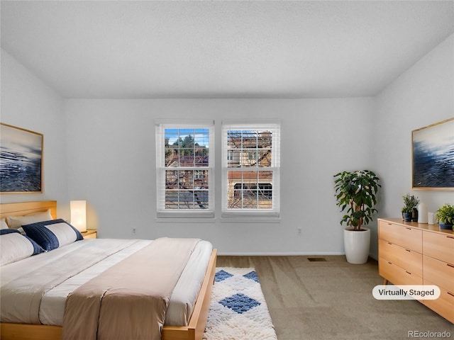 bedroom with carpet and visible vents