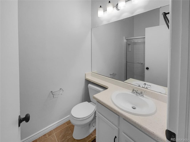 bathroom with baseboards, toilet, tile patterned floors, a shower with shower door, and vanity