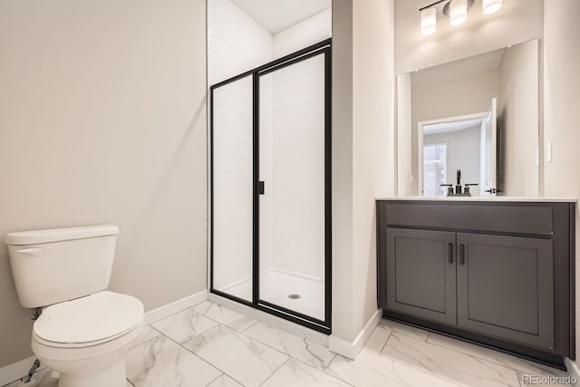 bathroom featuring toilet, vanity, and walk in shower