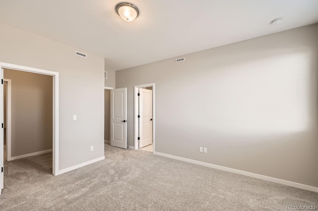 unfurnished bedroom featuring light colored carpet