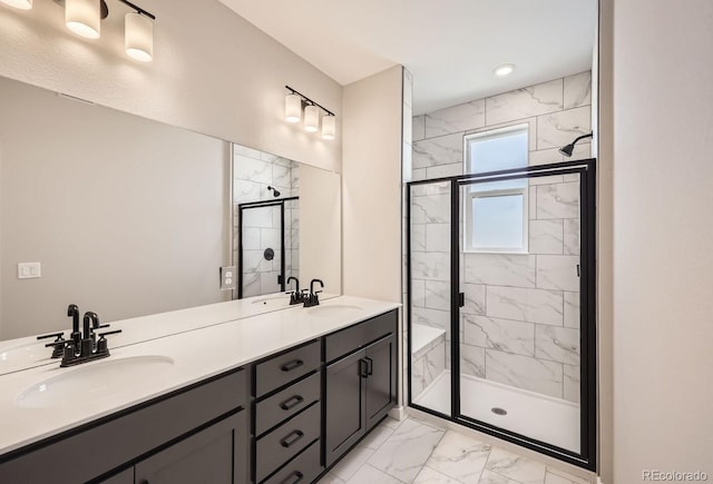 bathroom featuring vanity and a shower with door